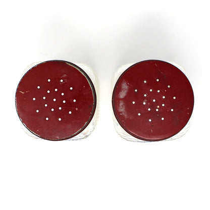 View of red lids from square glass salt and pepper shakers by Hazel Atlas