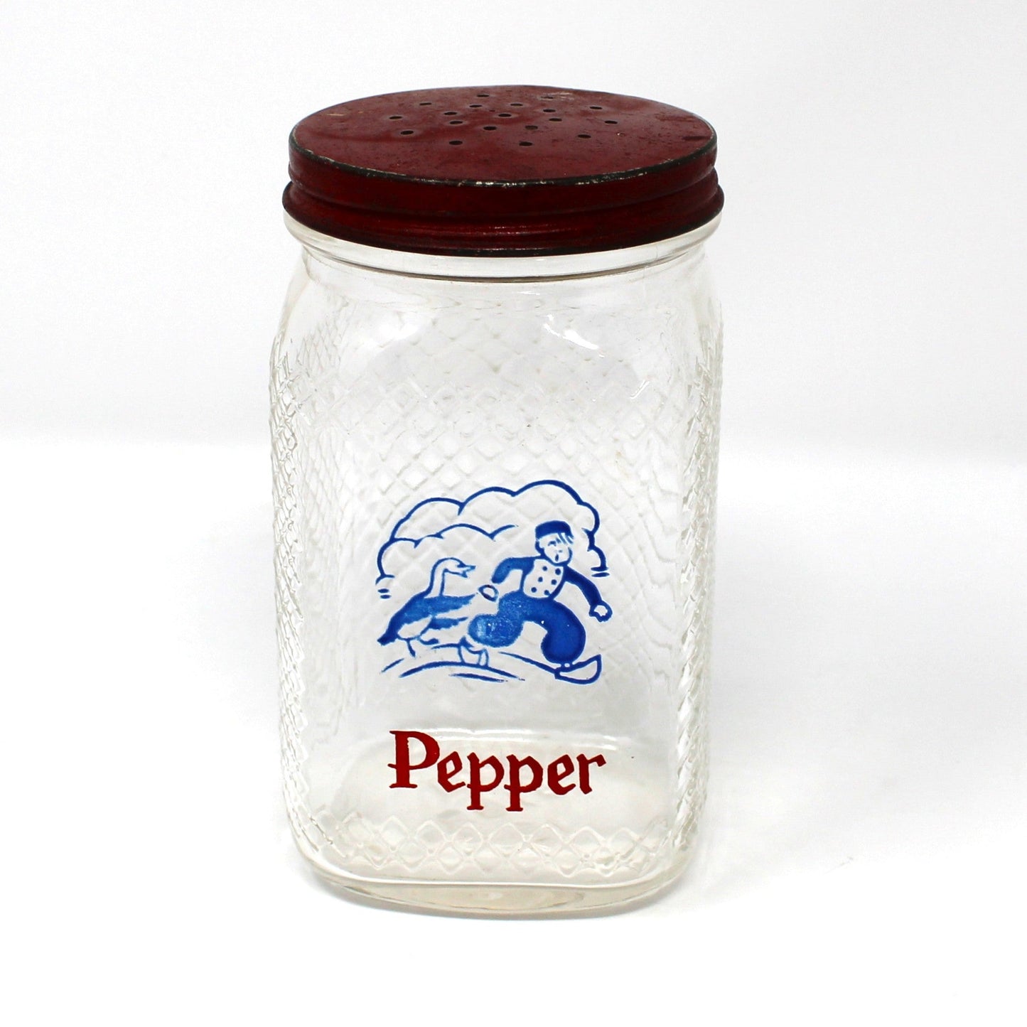 Vintage glass pepper shaker with red lid and Dutch boy with goose design.  Waffle glass square jar.