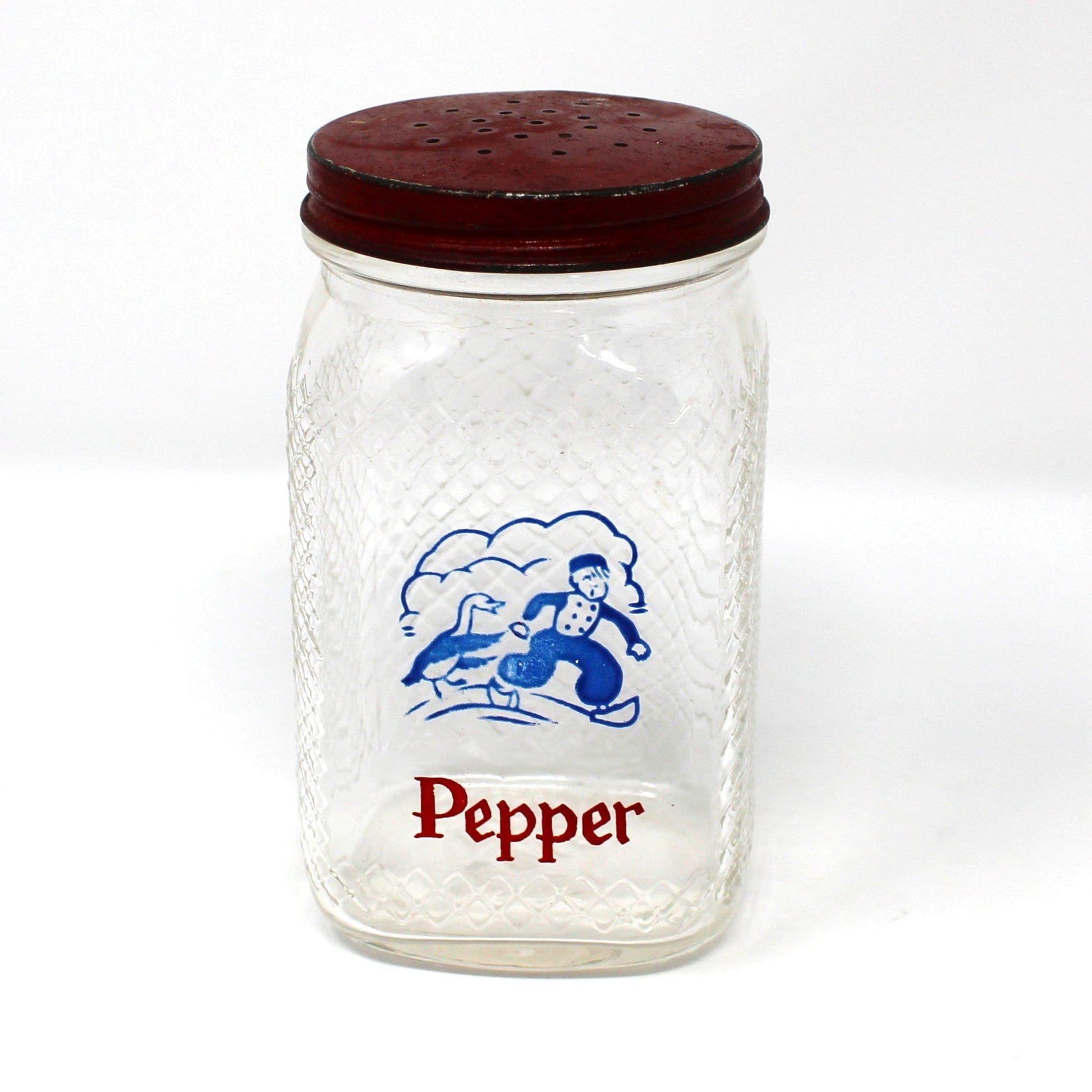 Vintage glass pepper shaker with red lid and Dutch boy with goose design.  Waffle glass square jar.