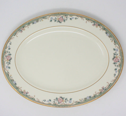 A Lenox Spring Vista serving platter with a floral pattern, beige swirls, gold verge, and gold-colored rim.