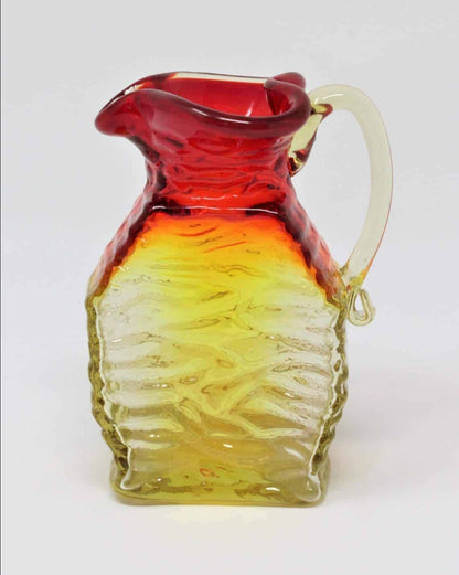 A Small Clear Crackled Amber Hand Blown Glass Pitcher With a