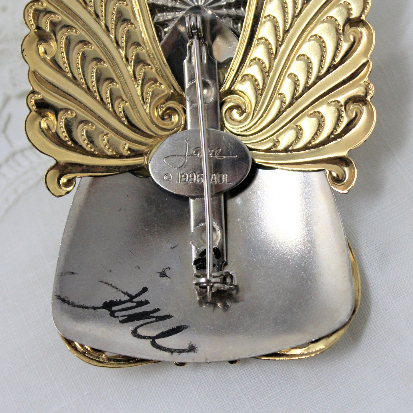 Close up of Jane Davis Angel Pin/Brooch with Signature and Date